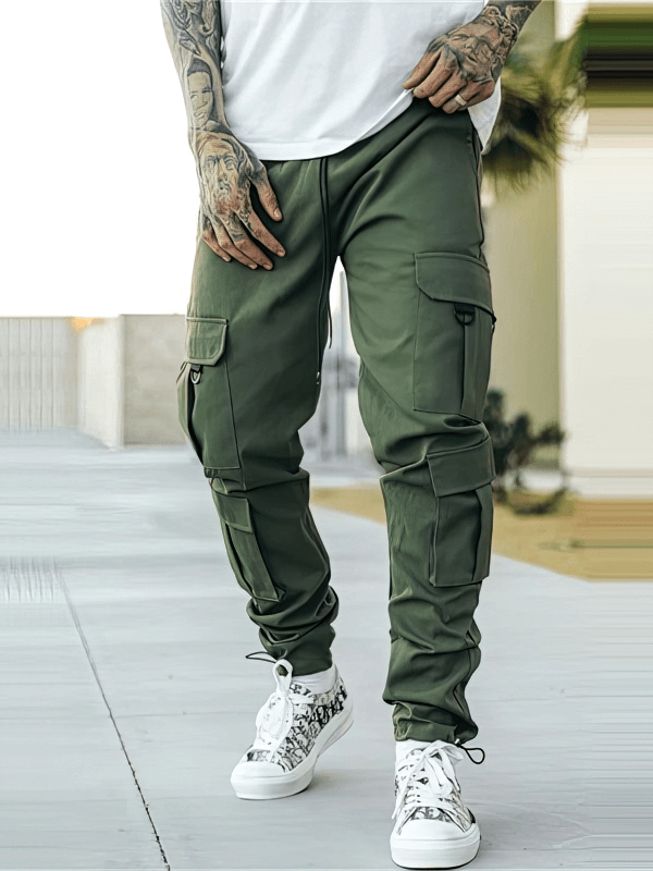 Stylish male joggers with multiple side pockets in olive green, featuring a comfortable fit for active lifestyles.